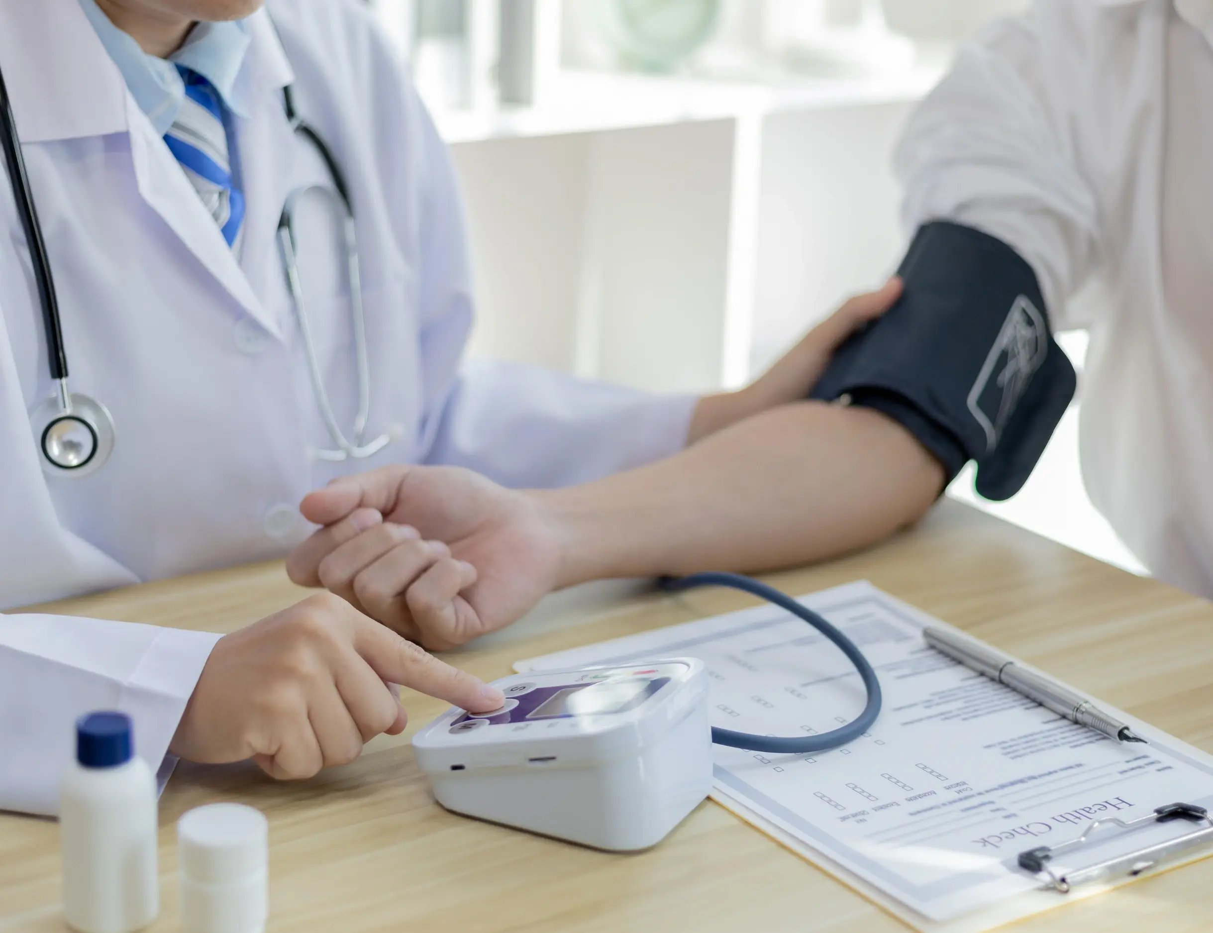 A doctor checking Blood pressure 