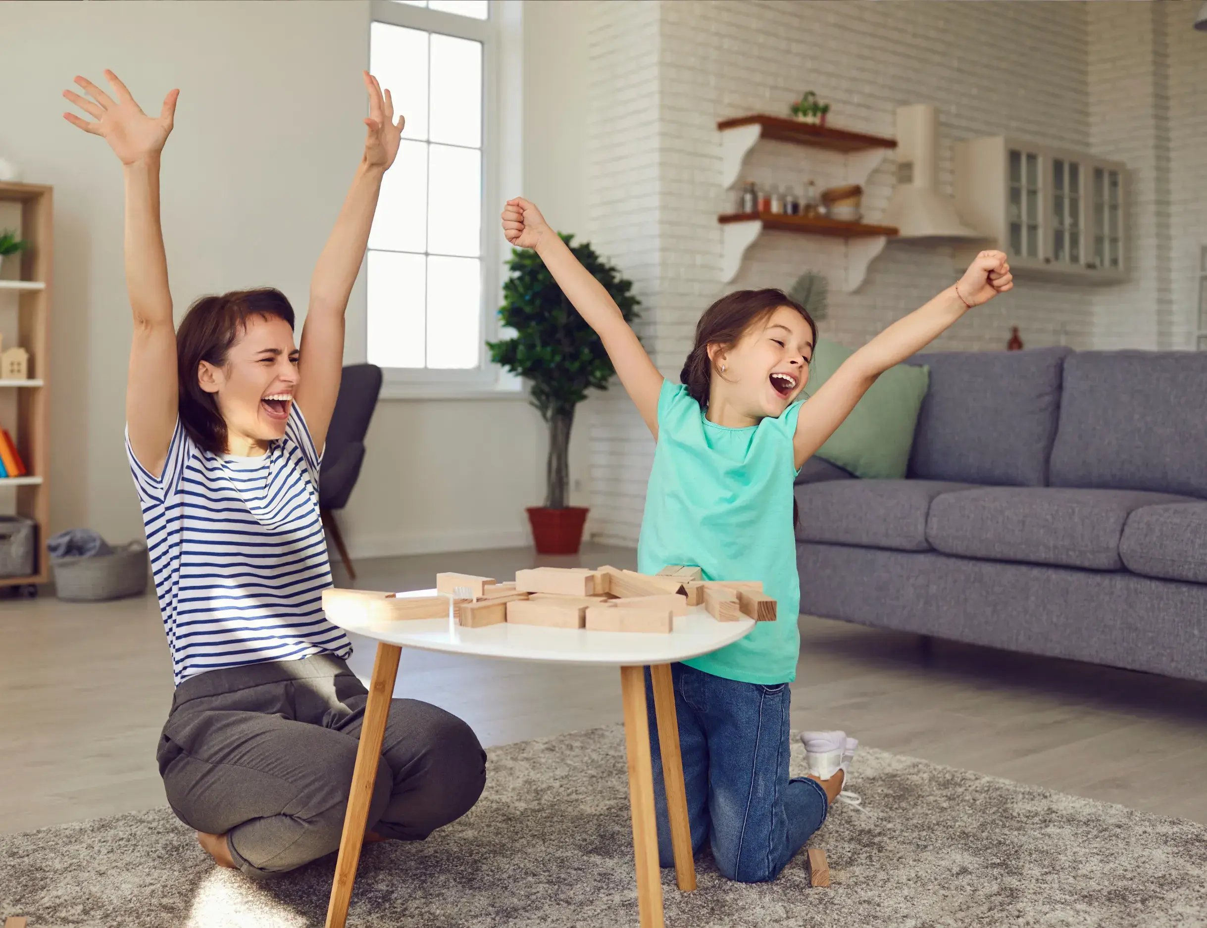 Mother-and-daughter-duo-playing-jenga